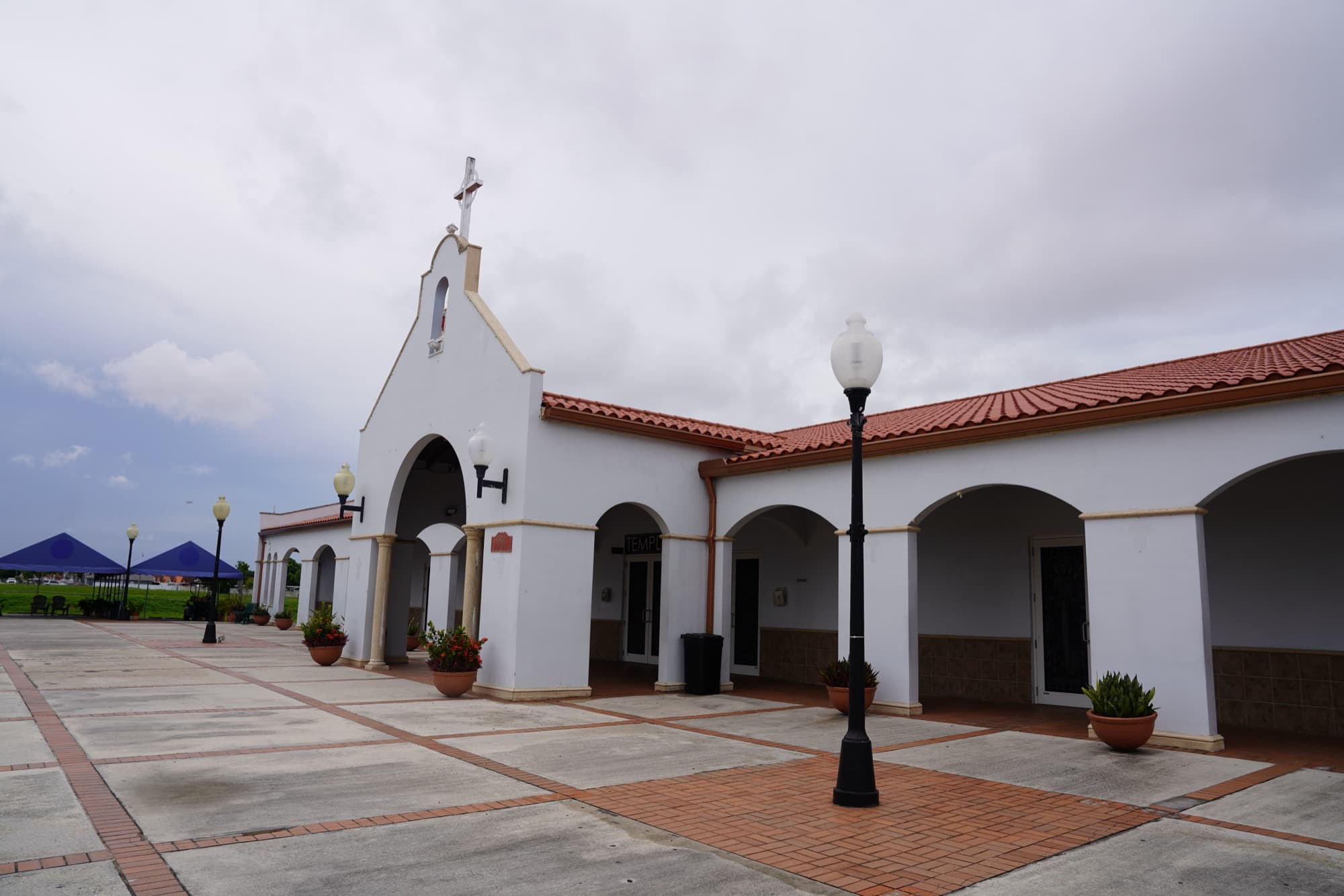 Santa Barbara Catholic Parish — Church exterior with bell tower and plaza